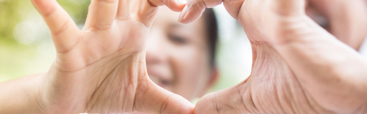 residents making a heart shape with their fingers