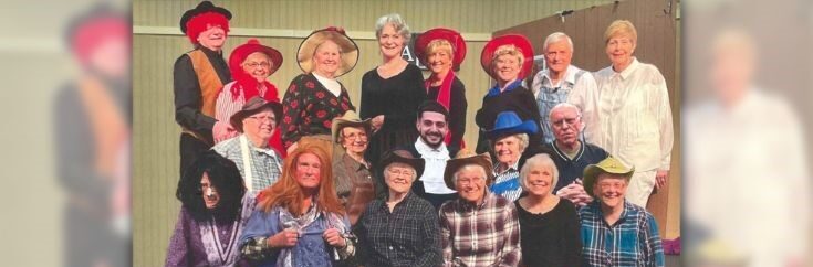 A photo of Freedom Village at Brandywine’s Village Players, a group of residents who come together to rehearse and perform live plays, dressed up in western attire.