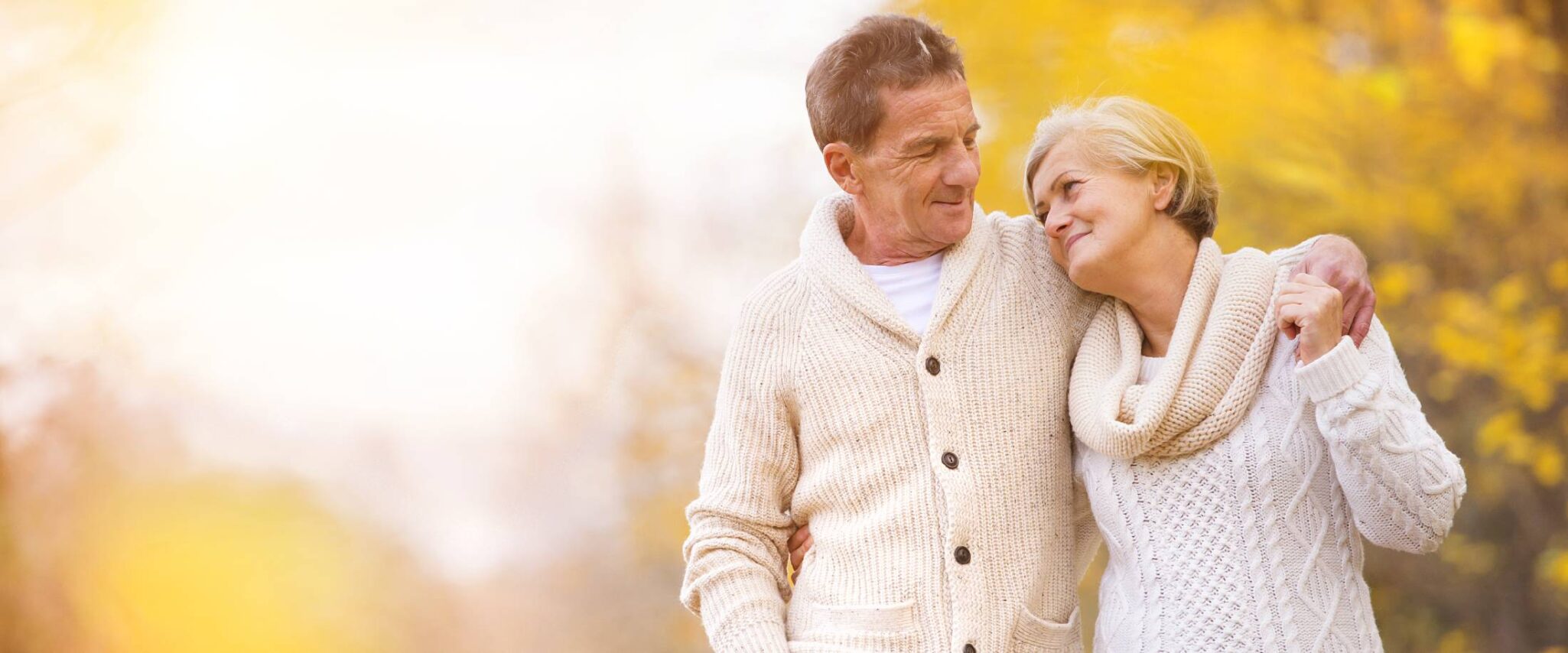 senior couple walking outside on an autumn day