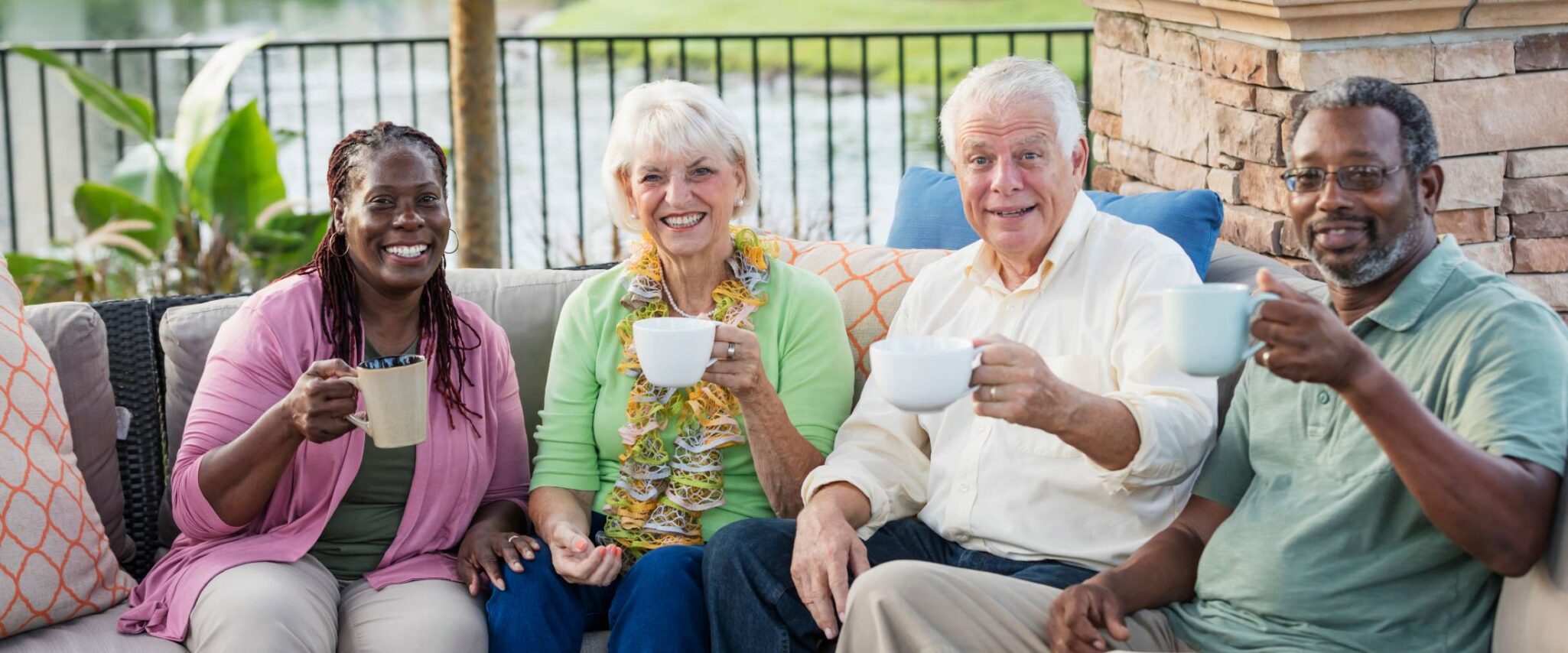 group of seniors drinking coffee at their senior living community