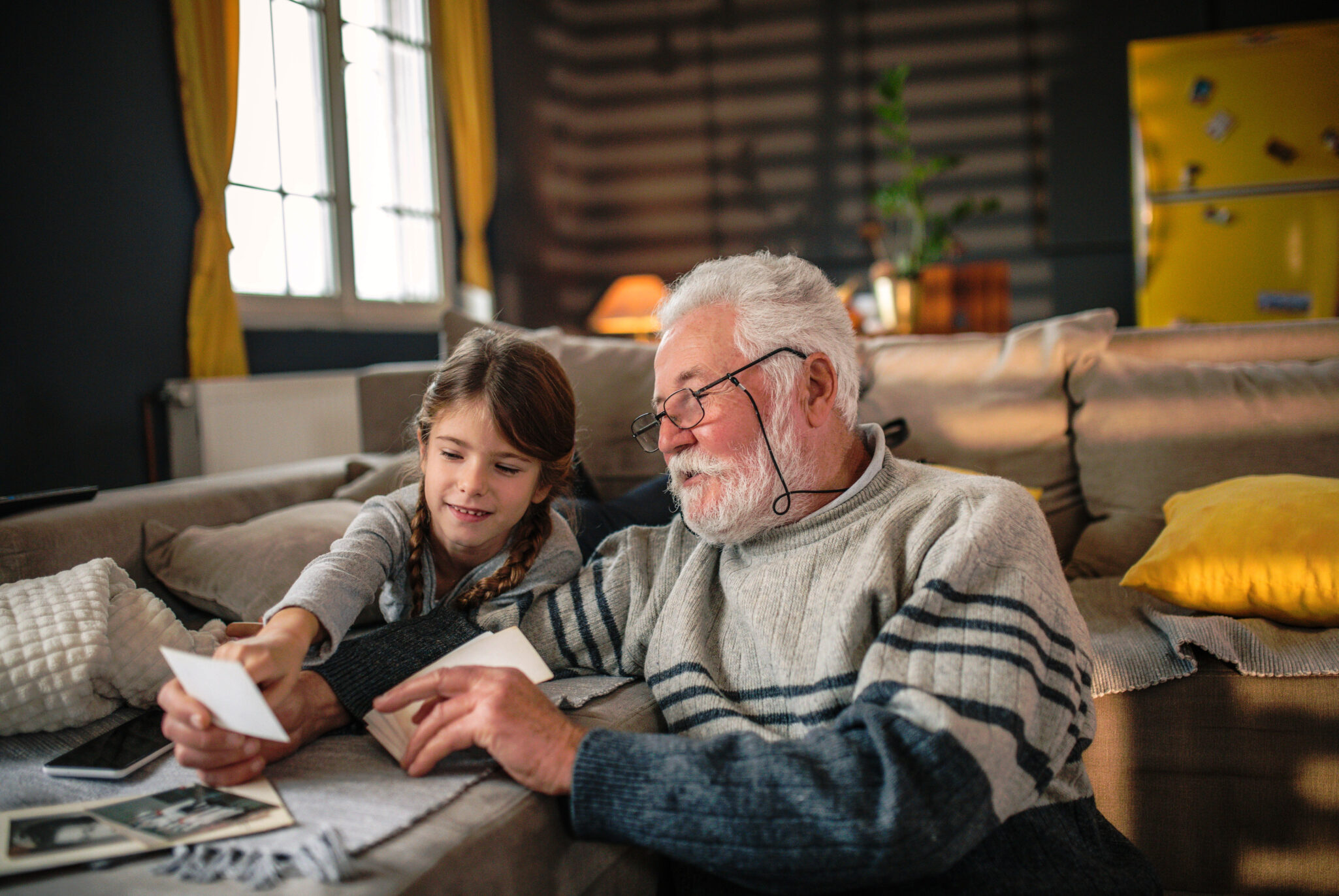 Grandad showing her granddaughter memories from past